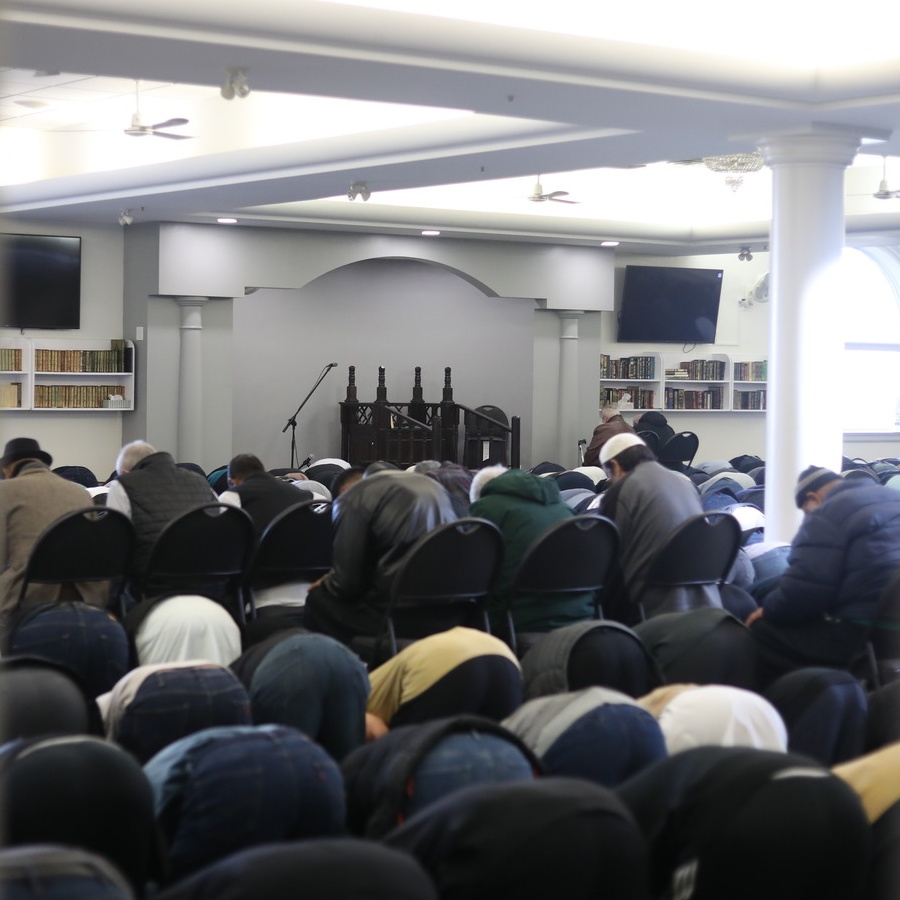 Group of Muslims praying at Islamic Centre of Canada