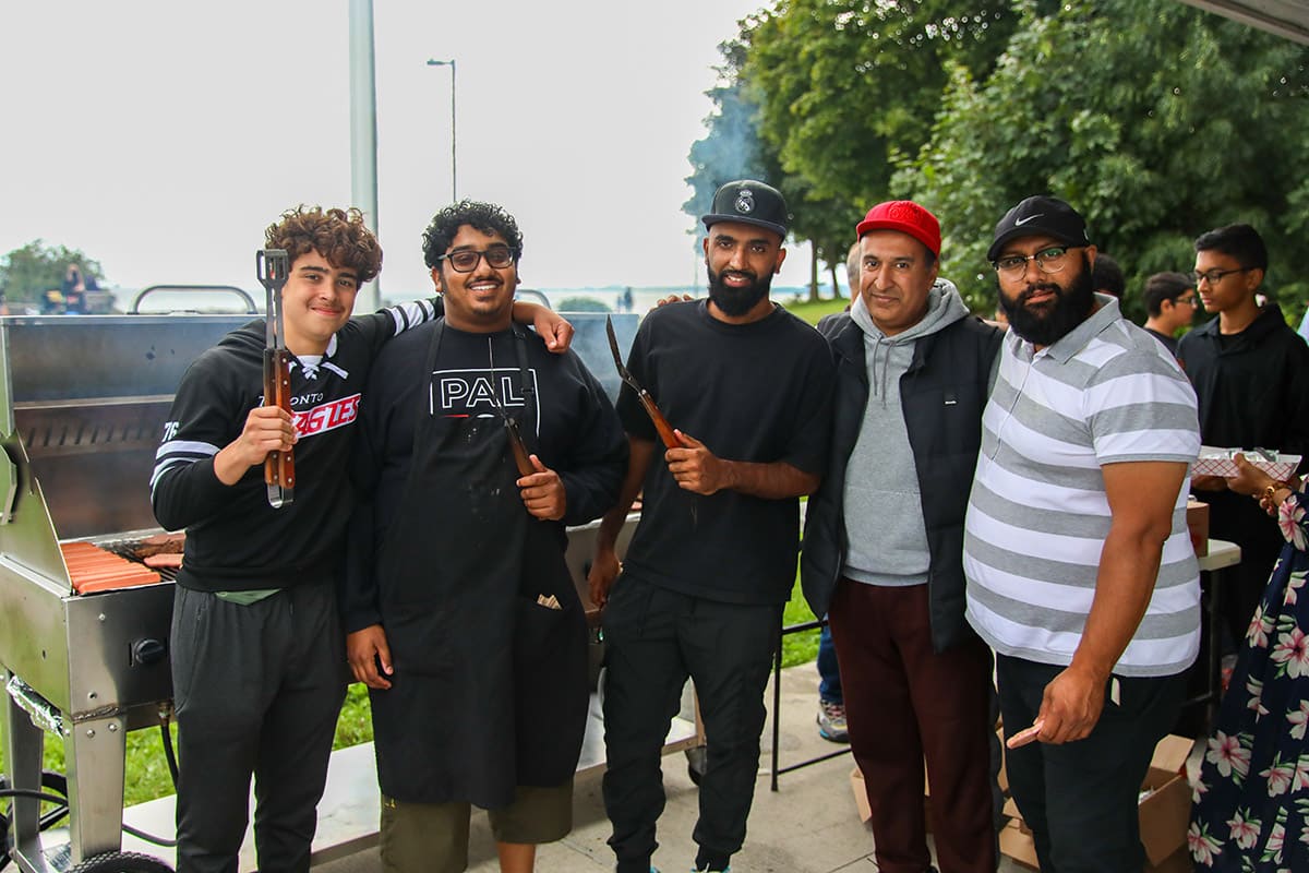 5 male ISNA Canada Volunteers standing together